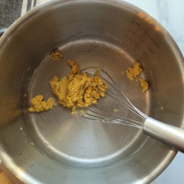 Oil and flour whisked together in a medium saucepan.