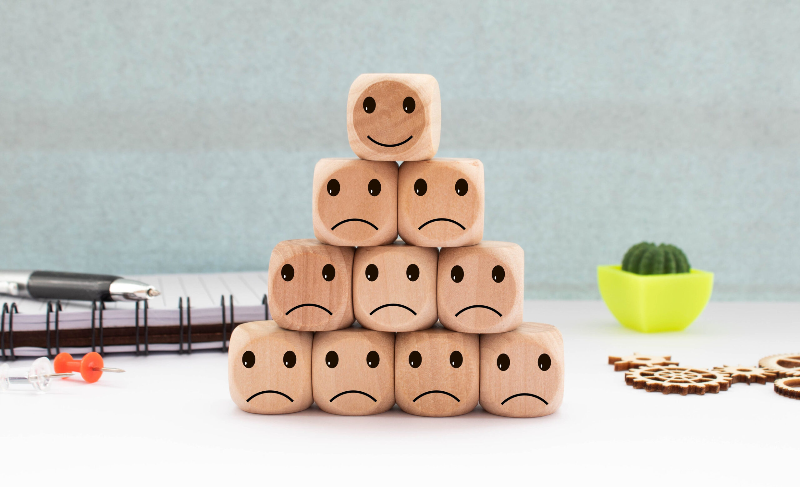 smile of a happy and not happy face on the table, rating, rating increase, customer experience, satisfaction. Positive and negative emoticons.