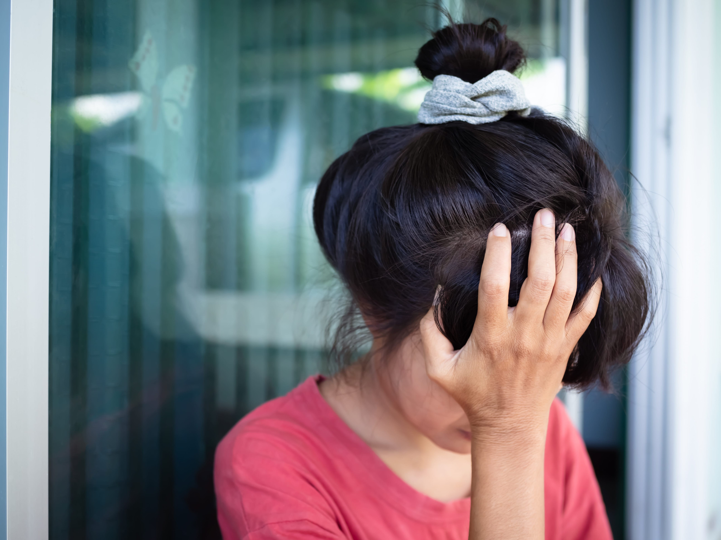Close up portrait woman cry and sad. authentic skin tan and black hair. slim fit female. card or poster for broken heart couple, valentine day or stress problem headache concept.