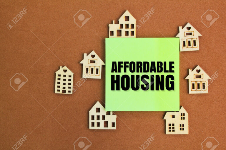 the shape of a wooden house with the word affordable house. affordable housing concept