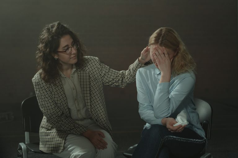 A comforting moment during a support session, highlighting empathy and understanding.