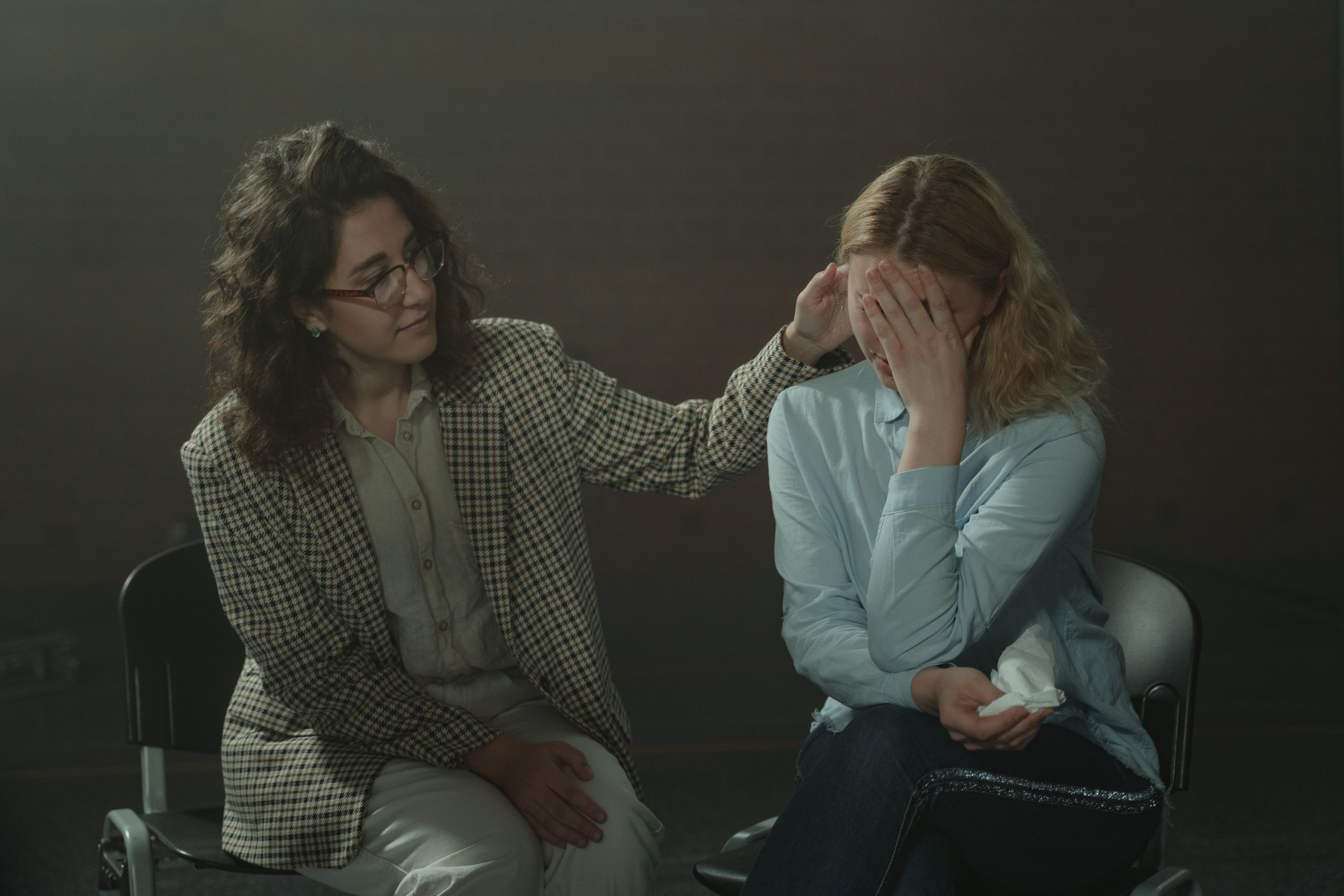 A comforting moment during a support session, highlighting empathy and understanding.