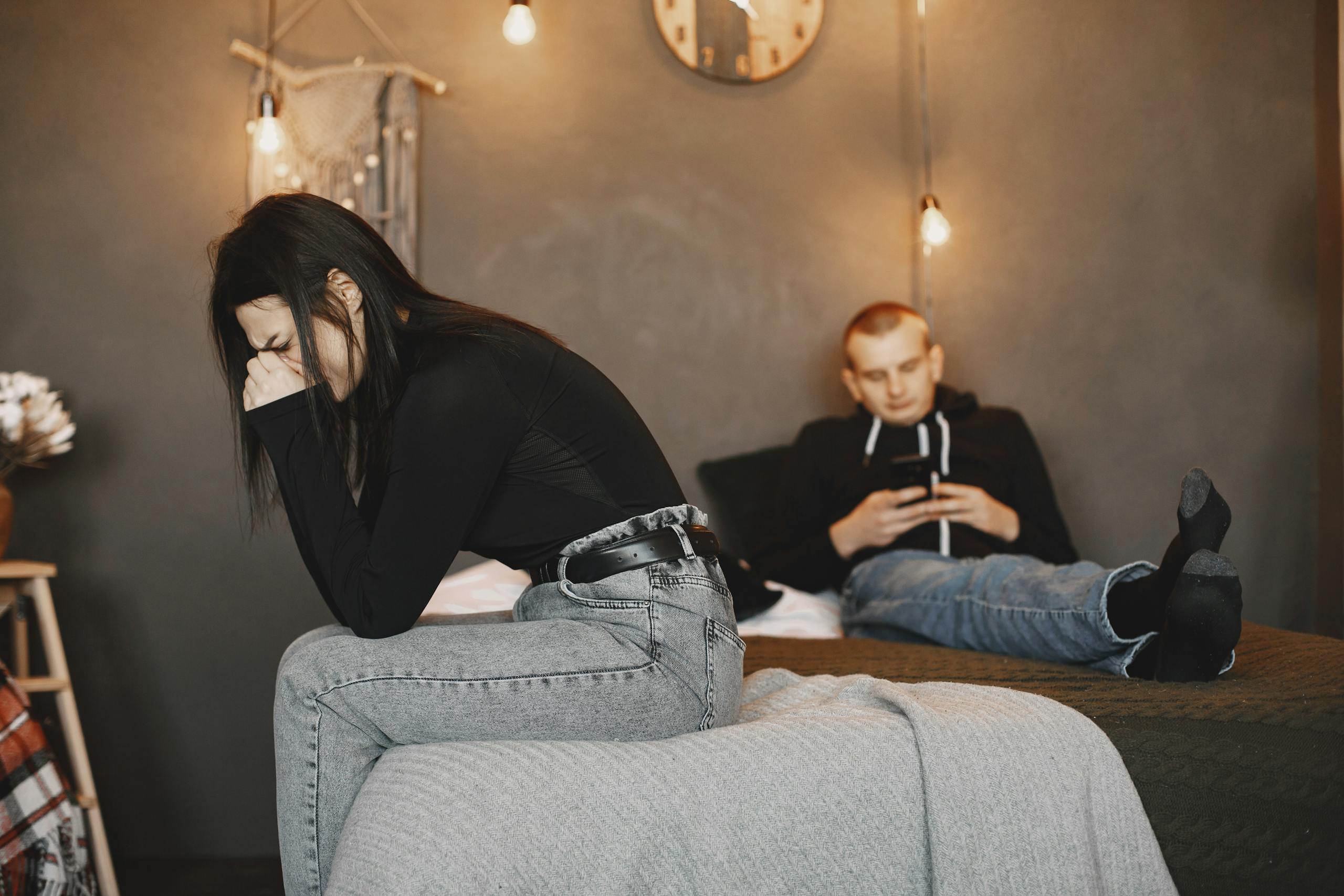 A couple experiencing tension and distance, highlighting relationship challenges.