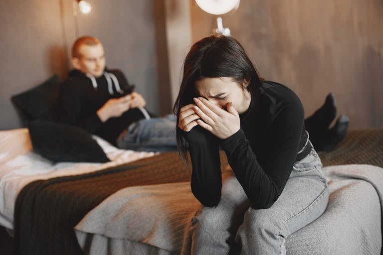 A couple experiencing tension and sadness