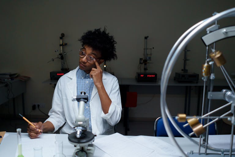 A young adult conducting scientific research in a modern laboratory setting.