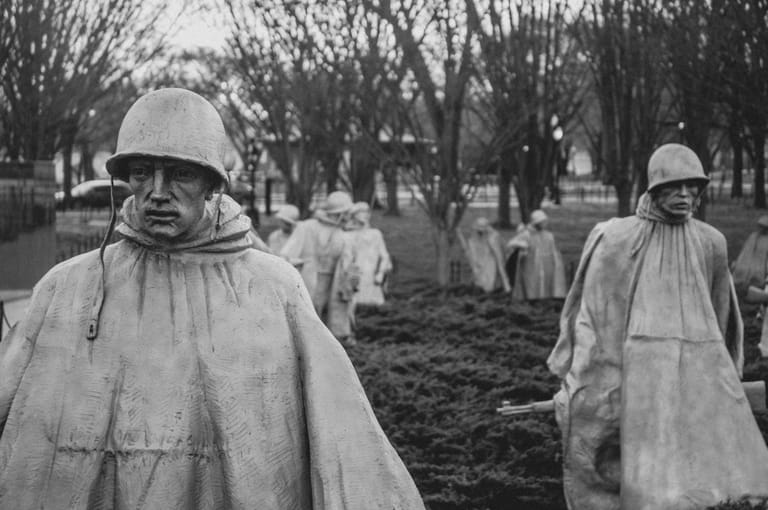 Black and white image of the Korean War Veterans Memorial statues in Washington, DC.