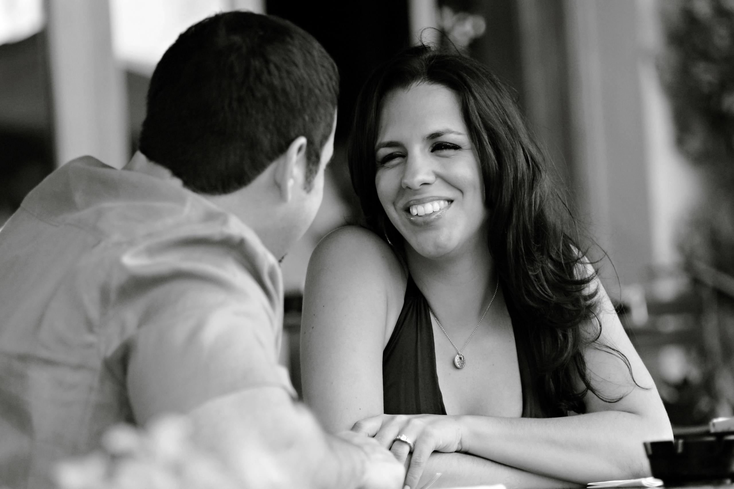 Black and white photo of a happy couple sharing a moment together.