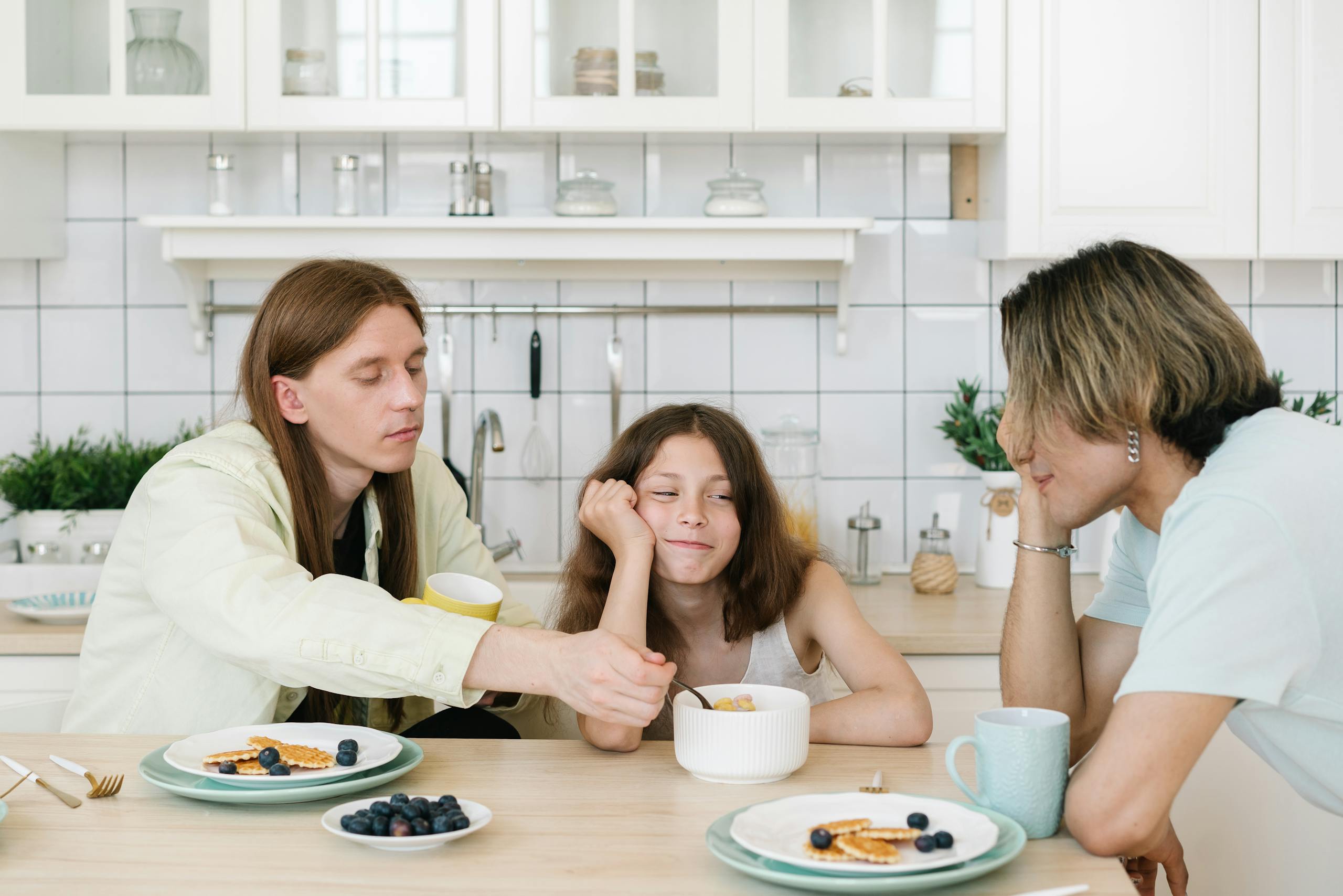 Casual family breakfast in a bright kitchen setting, fostering togetherness.