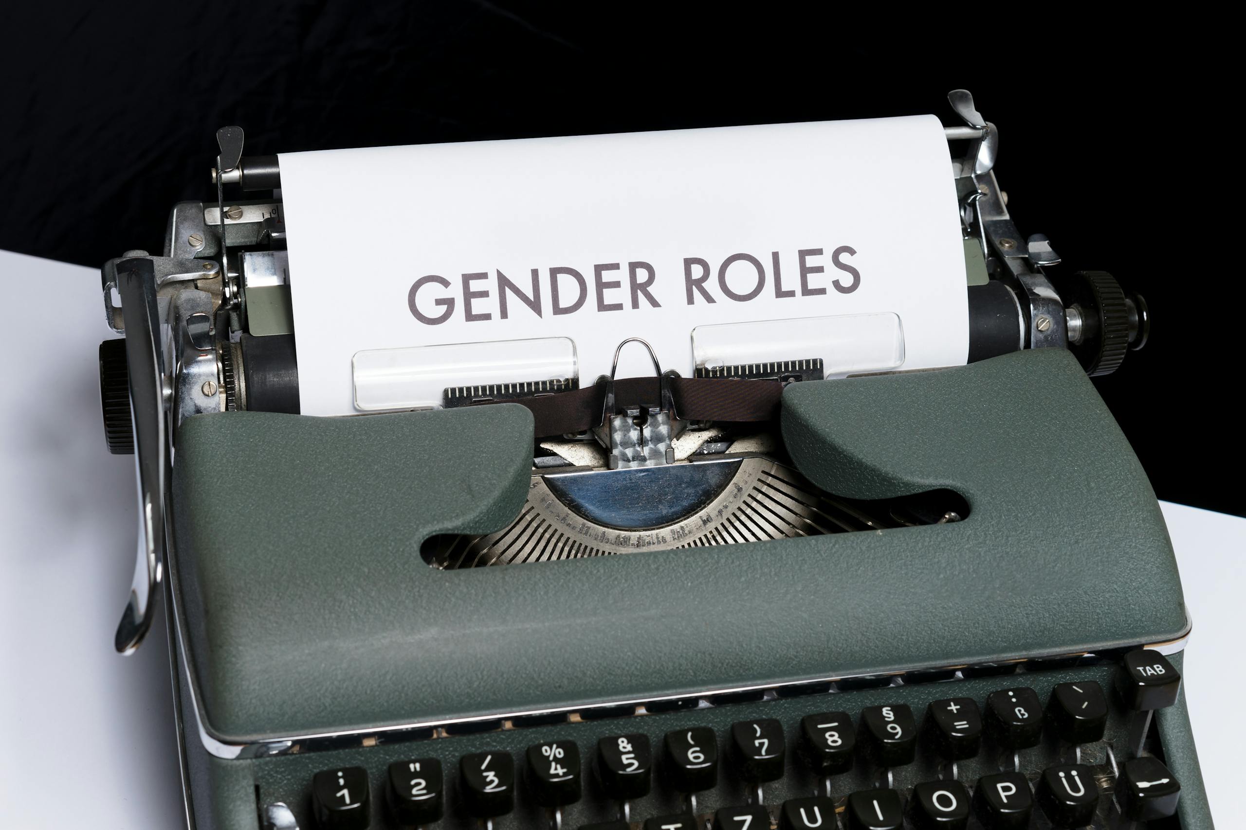 Classic typewriter showcasing the text 'Gender Roles' on paper, highlighting social themes.