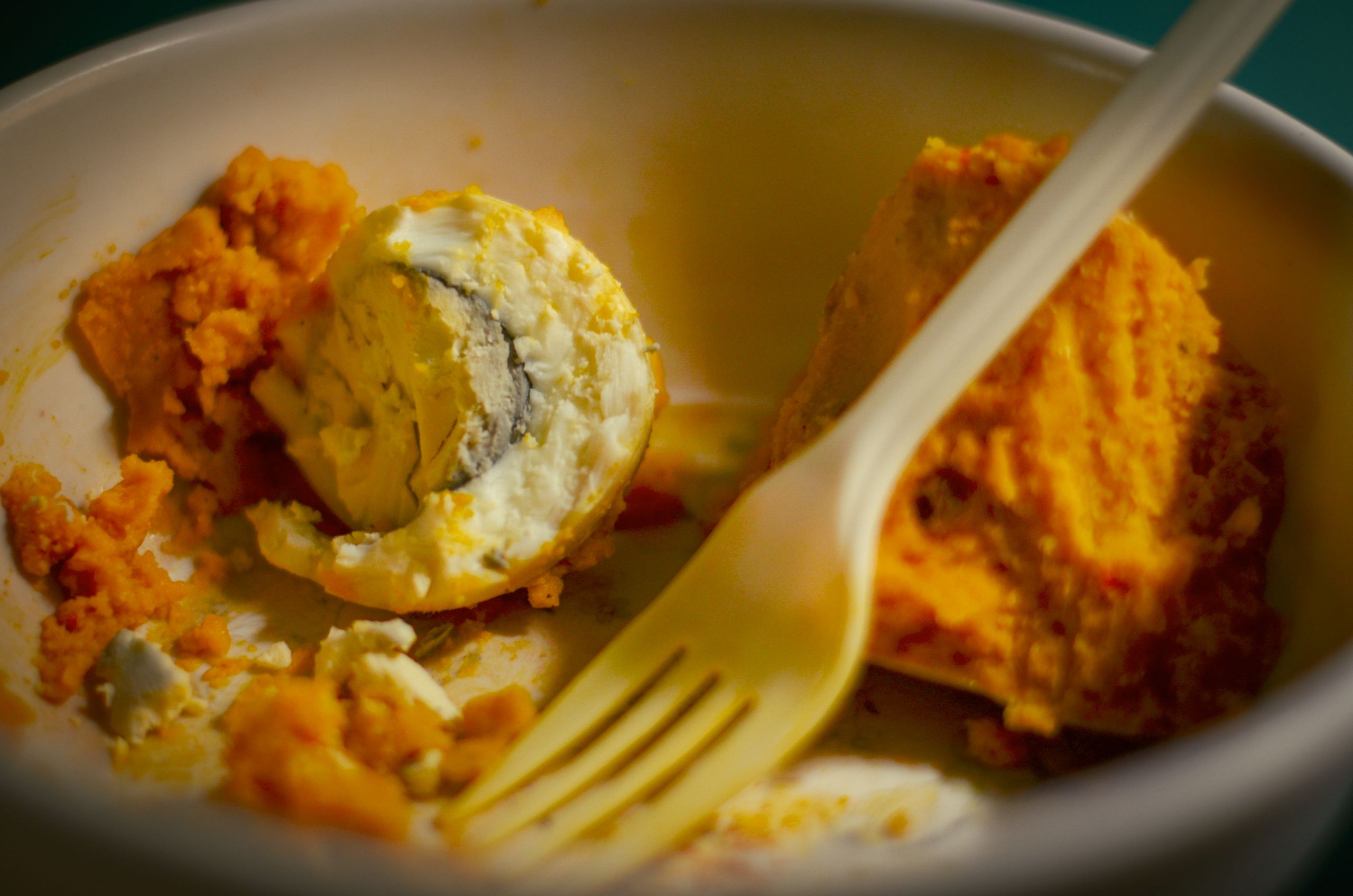 Close-up of a traditional African egg dish served with mashed root vegetables in a bowl.
