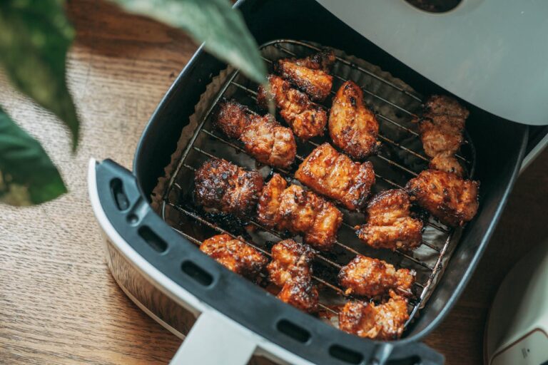 Delicious crispy chicken pieces cooked perfectly in a modern air fryer, ready to serve