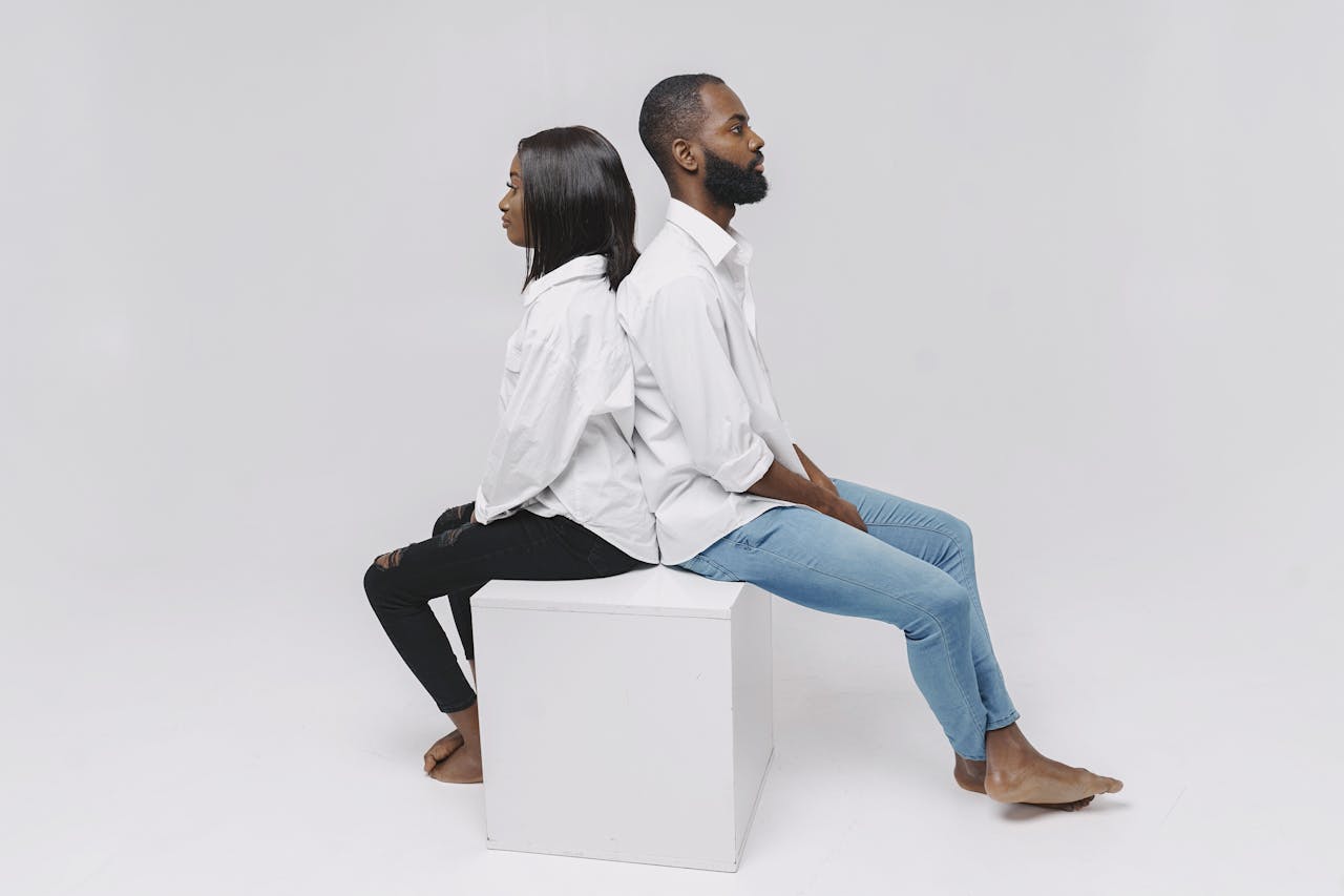 studio-shoot-of-a-couple-sitting-on-white-box-