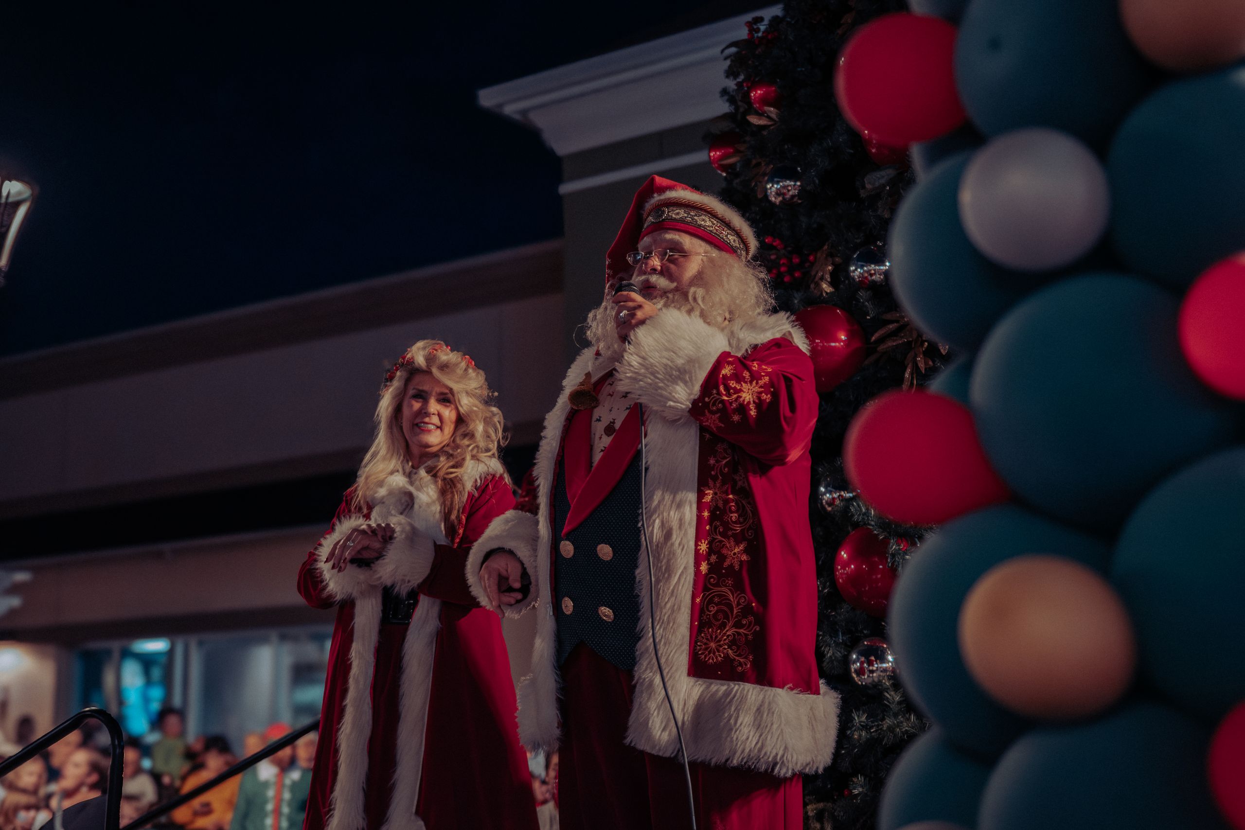 Santa and Mrs Claus spreading holiday cheer at a Christmas event.