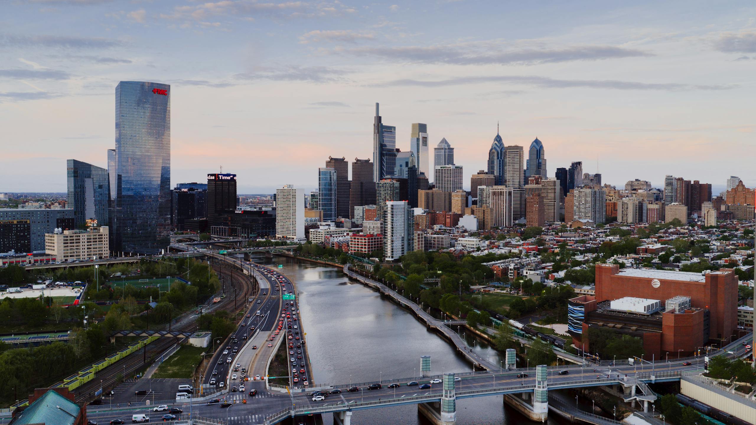 Stunning aerial view of Philadelphia's skyline with iconic skyscrapers and the Schuylkill River during the day.