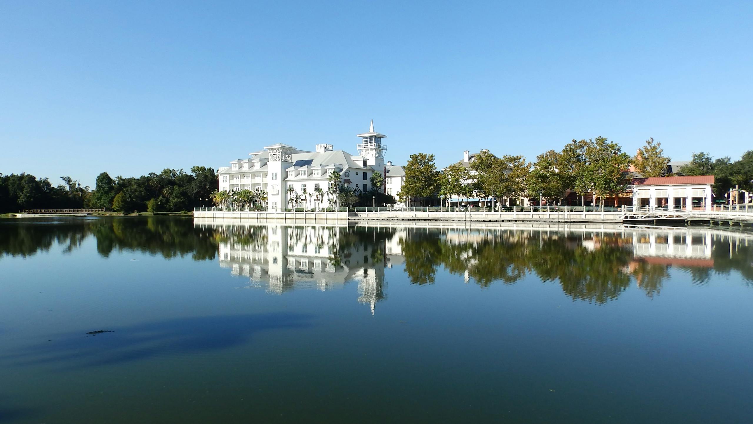 Stunning view of elegant lakeside buildings reflecting in the water in Celebration, Florida.