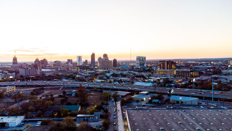 A breathtaking aerial view of San Antonio's skyline during sunset, showcasing its urban charm and high-rise buildings.