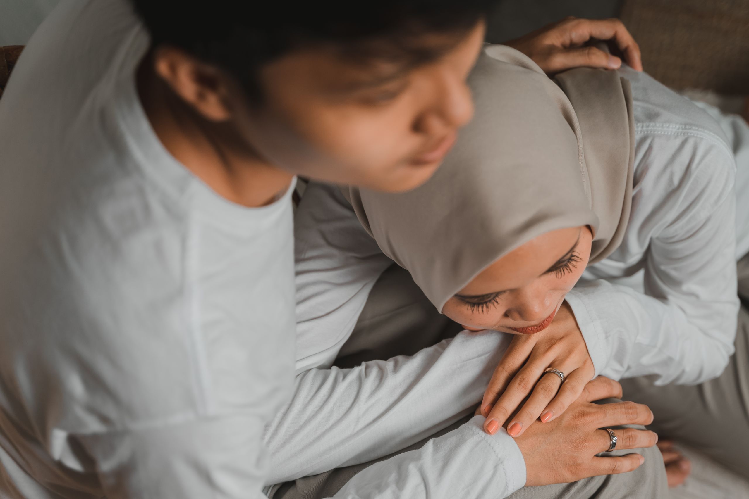 A close-up of a couple hugging, showcasing warmth and affection. Captured in Jakarta, Indonesia.