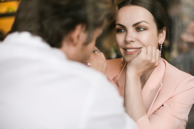 A couple sharing a heartfelt moment indoors, showcasing love and connection.