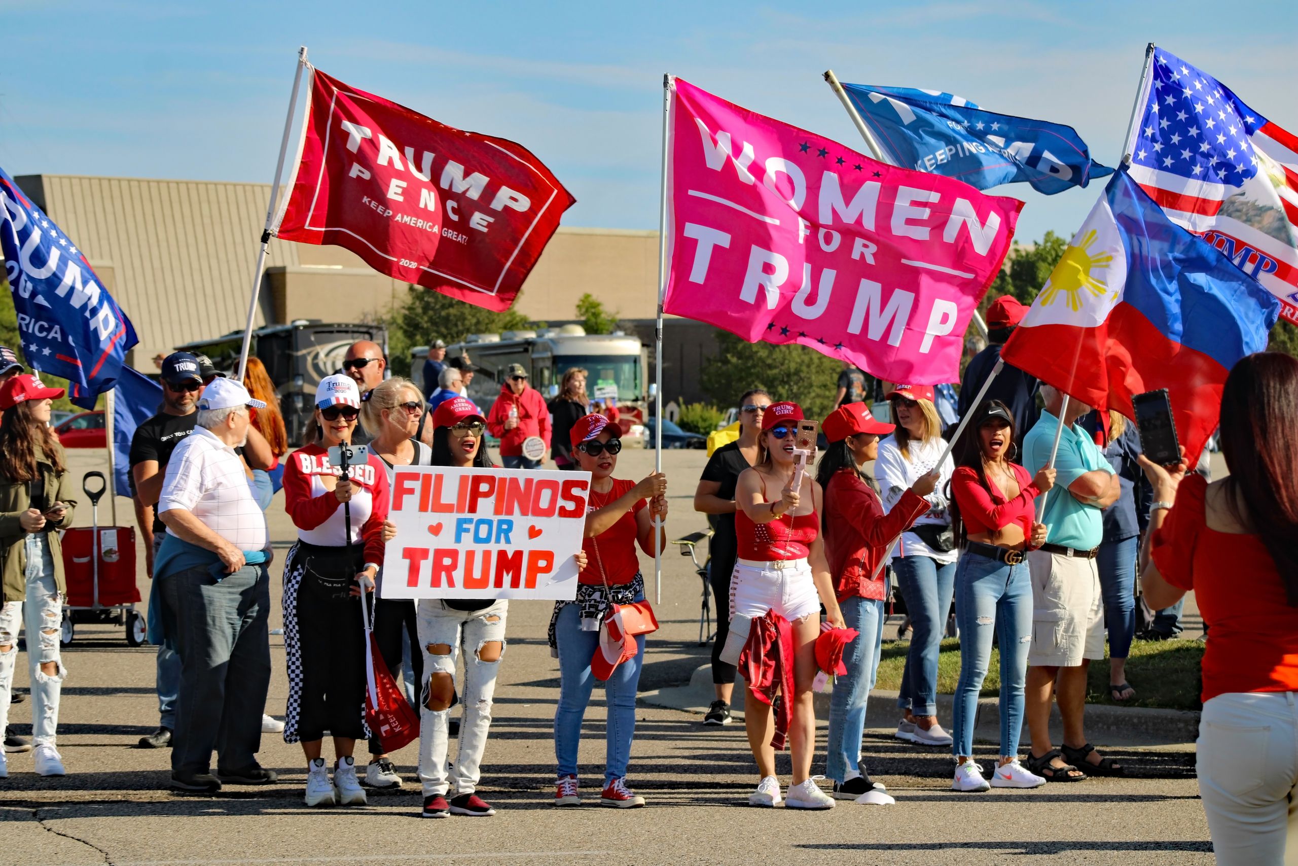 A group of diverse supporters at a political rally in Michigan.