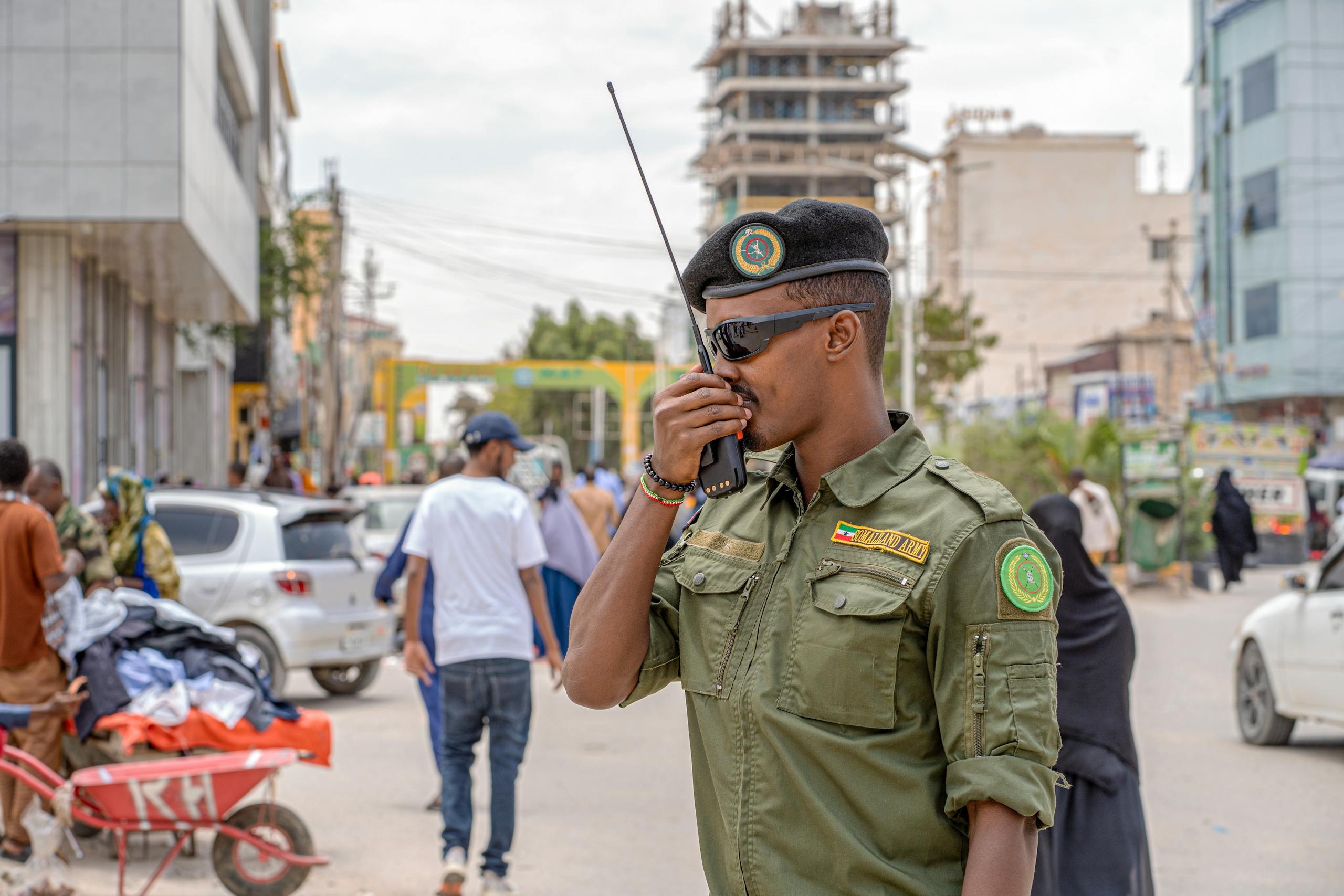 A military officer uses a radio in Hargeisa, Somalia, demonstrating peacekeeping efforts.