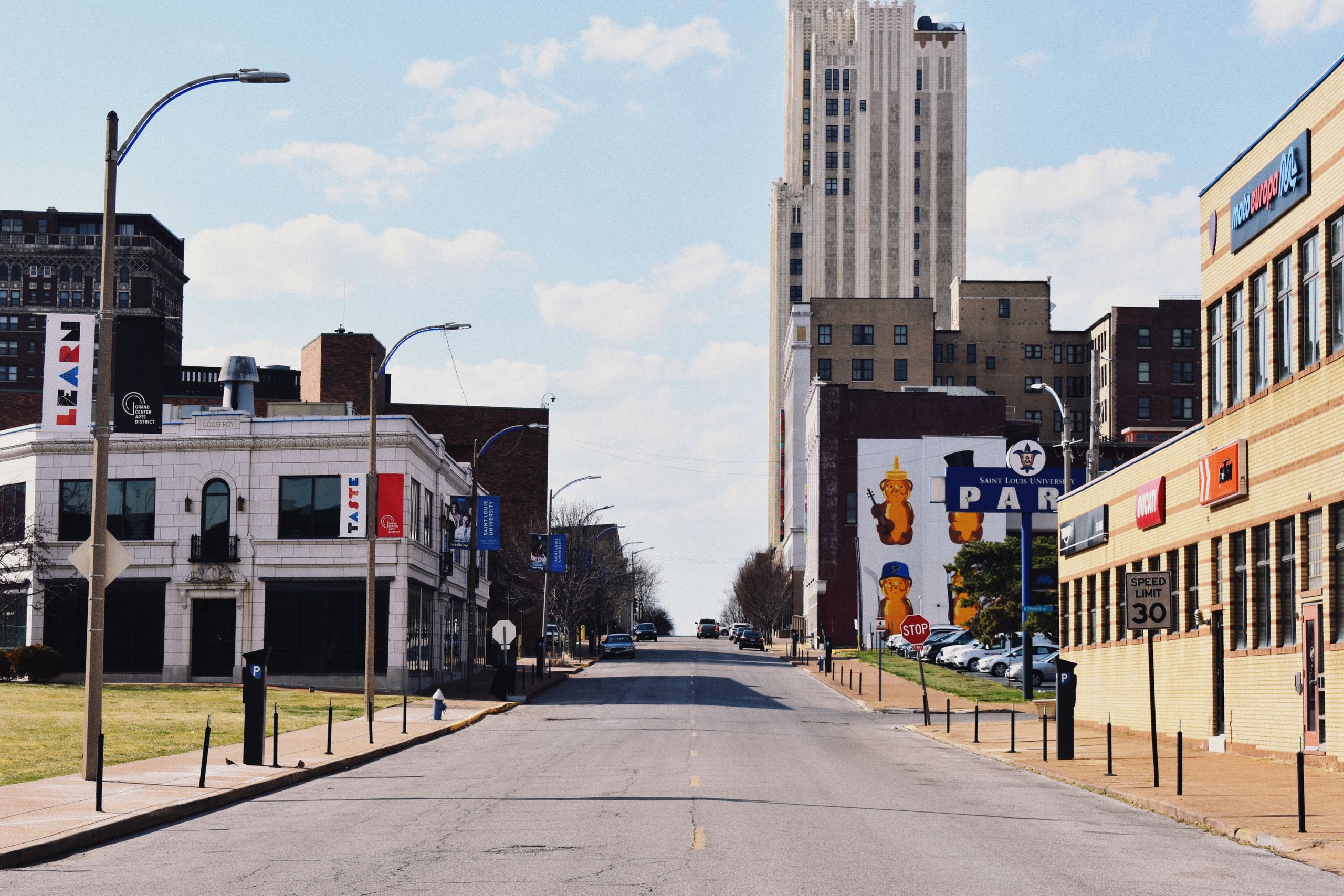 A vibrant city street in St. Louis, showcasing historic architecture and urban life.