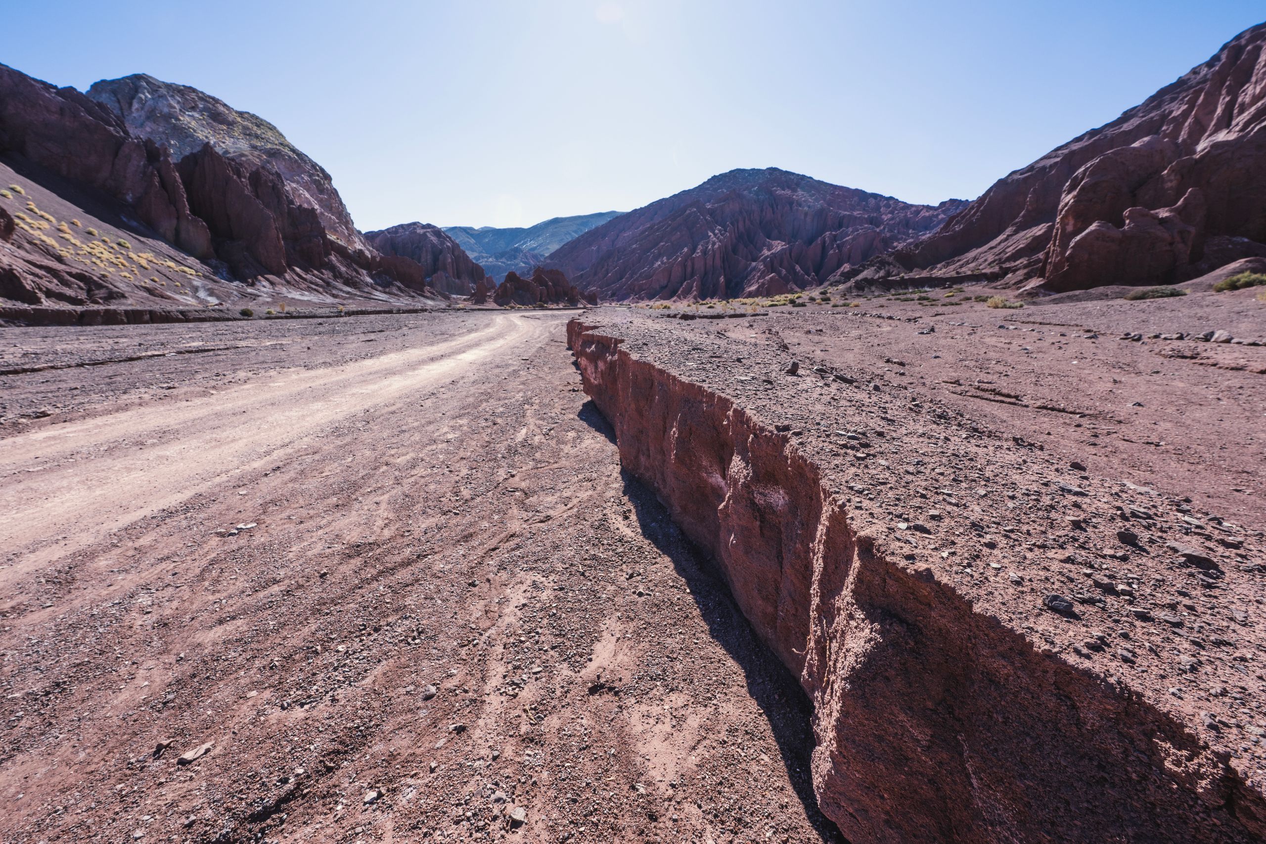 Breathtaking view of rugged red rock formations under a clear blue sky in Antofagasta, Chile.