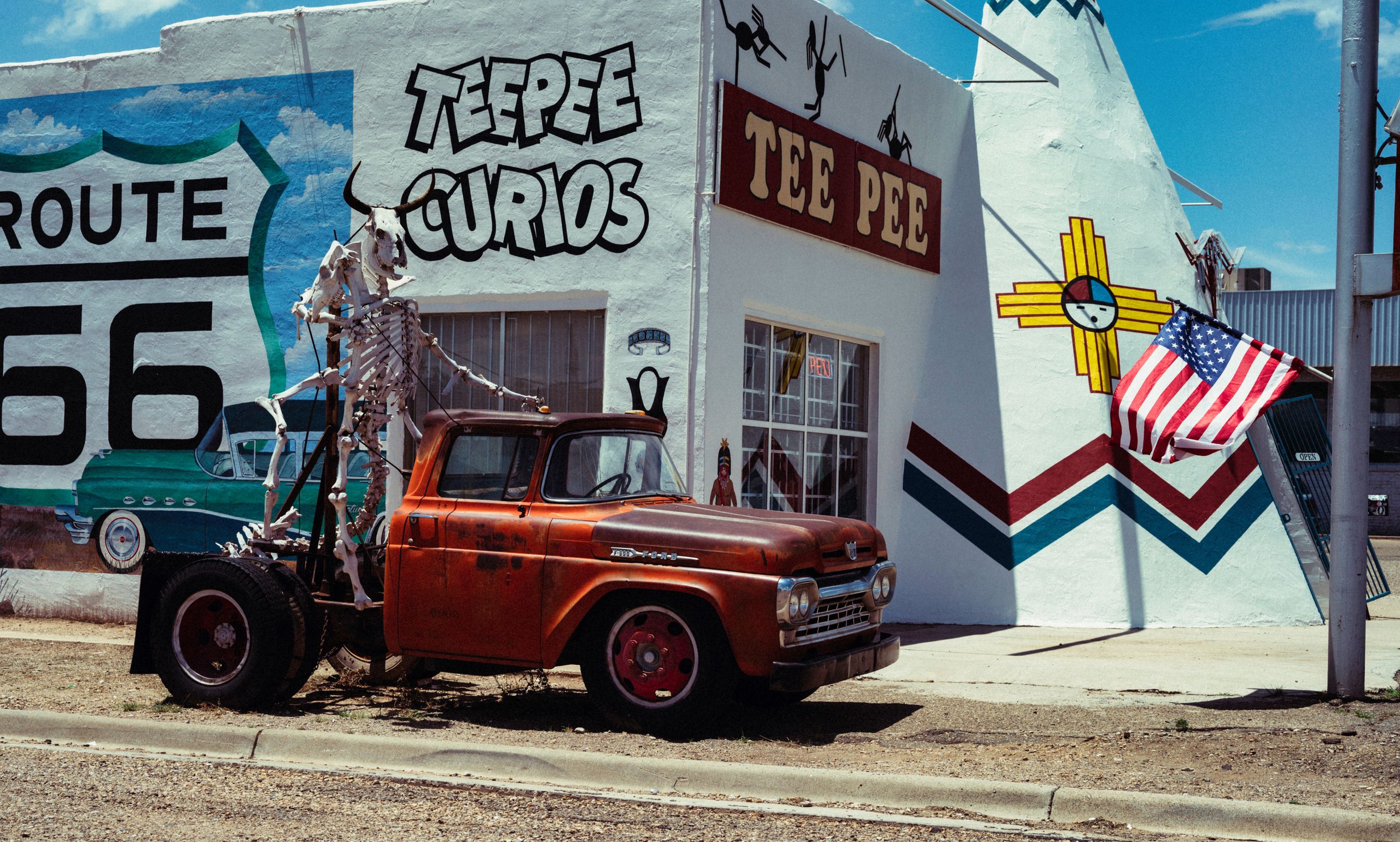 Classic vintage car and teepee curios shop on historic Route 66 in Tucumcari, New Mexico.