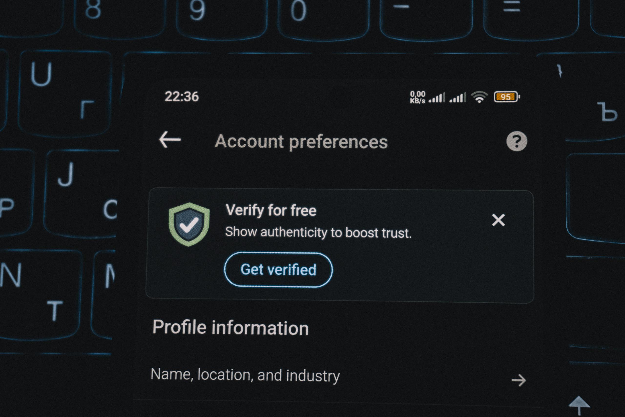 Close-up of a smartphone screen displaying account verification alert. Ideal for security and authenticity themes.