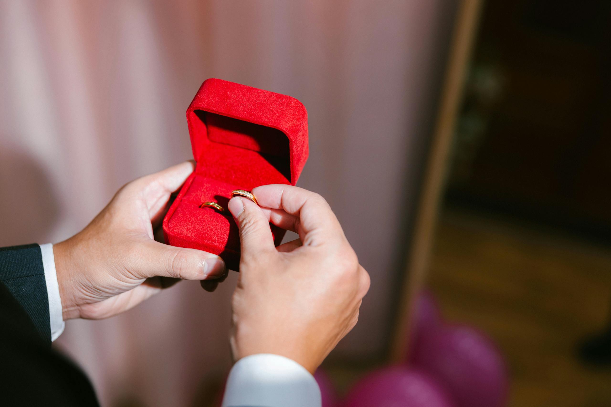 Close-up of a stylish ring in a red velvet box, symbolizing commitment and elegance.