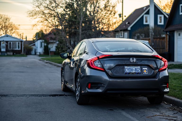 Contemporary Honda Civic on a quiet residential street in Toronto at sunset.
