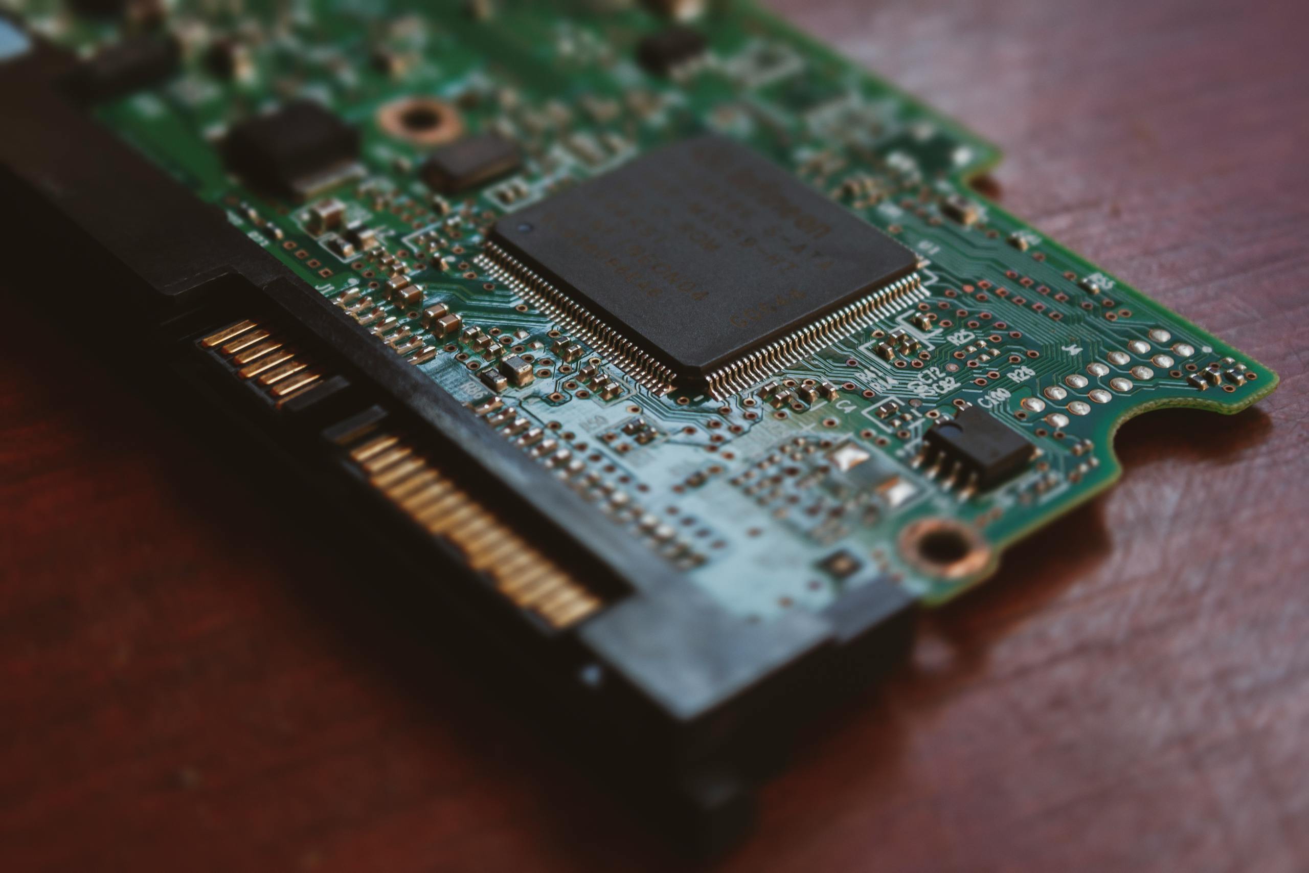 Detailed shot of a computer circuit board showing components and golden pins.