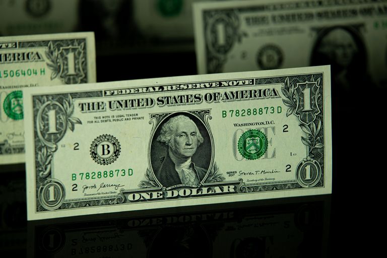 Detailed shot of a one dollar bill highlighting currency and finance themes.