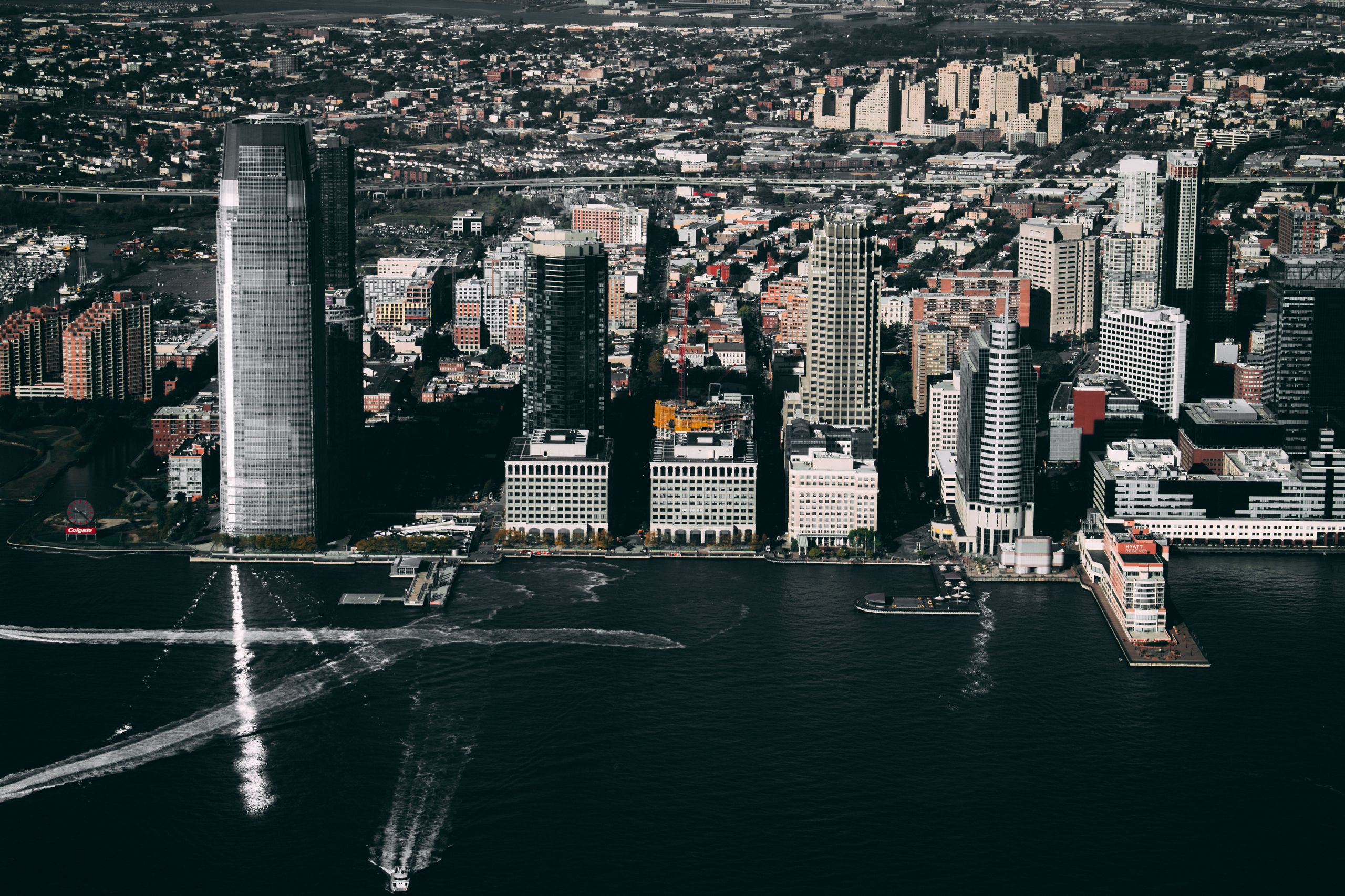 Dramatic aerial view of the Jersey City skyline showcasing prominent skyscrapers along the Hudson River.