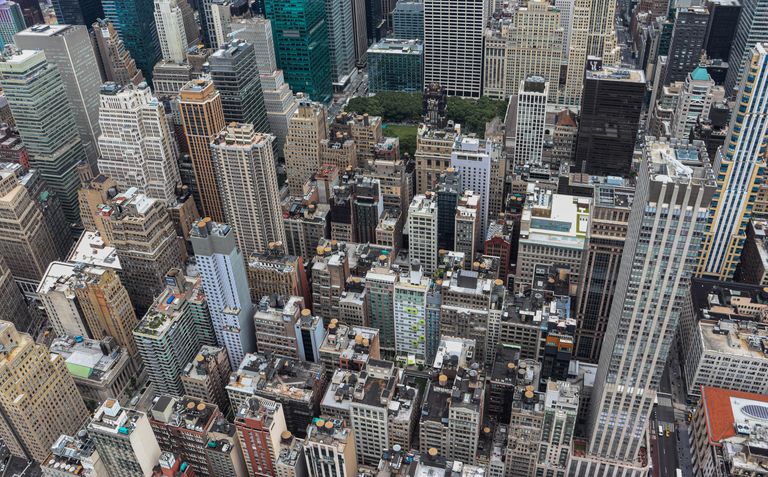 Dynamic aerial view of Manhattan's iconic skyscrapers showcasing New York City's urban landscape.