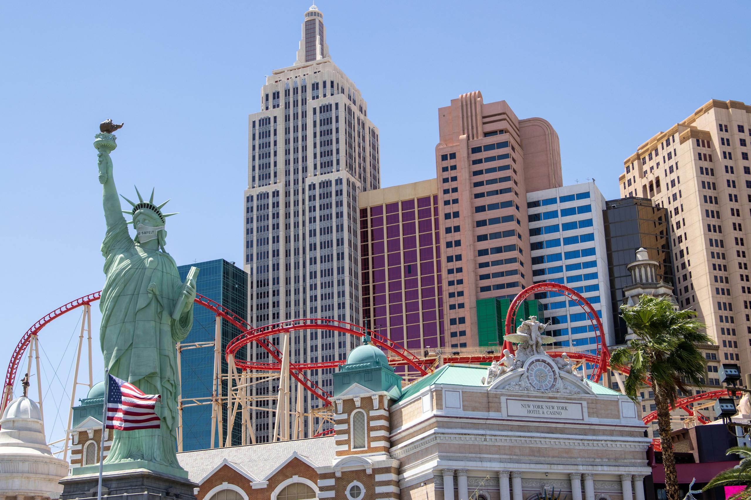 Iconic Las Vegas skyline featuring New York-New York Hotel with replica Statue of Liberty.