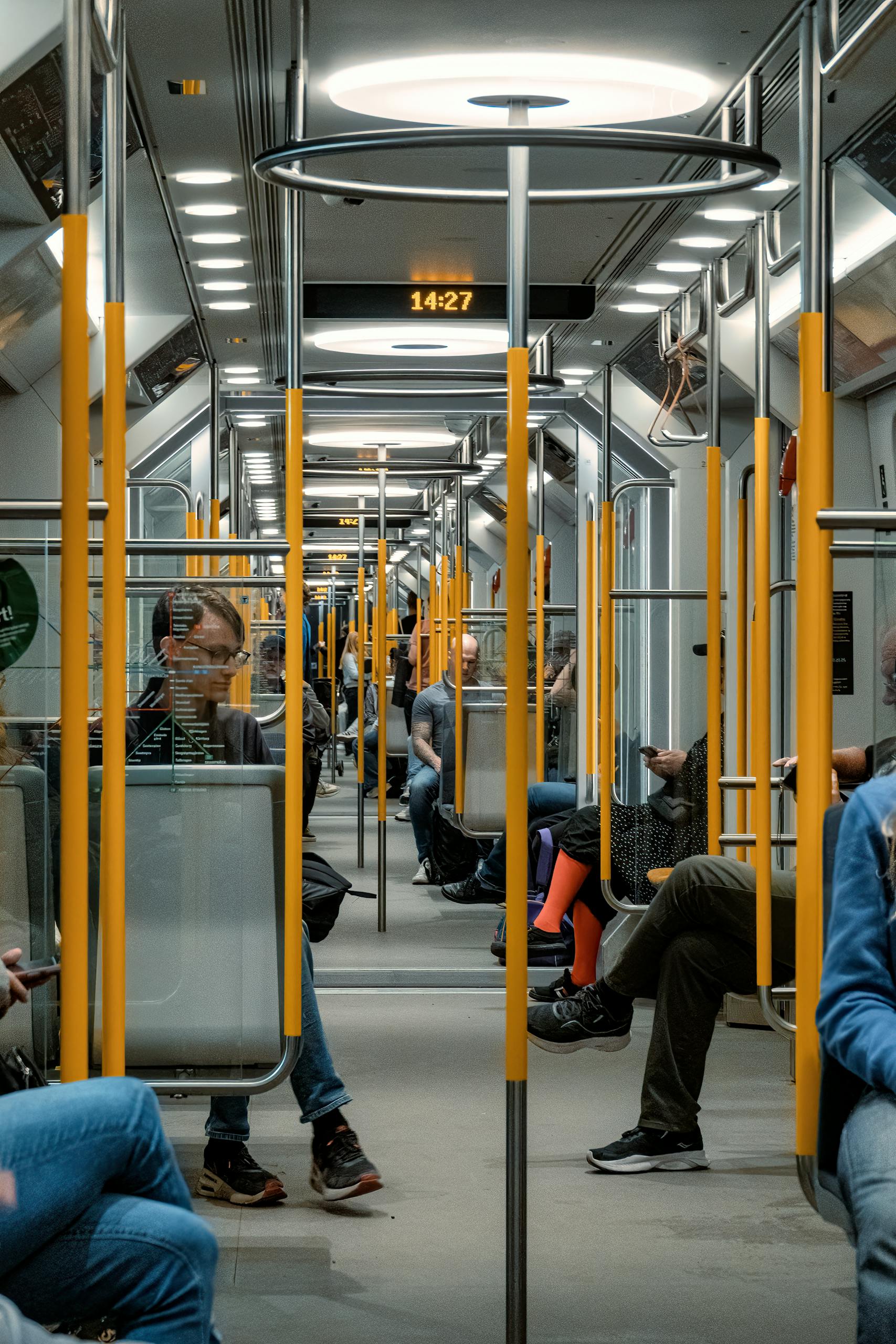 Passengers riding the modern Stockholm subway, showcasing daily urban life in Sweden.