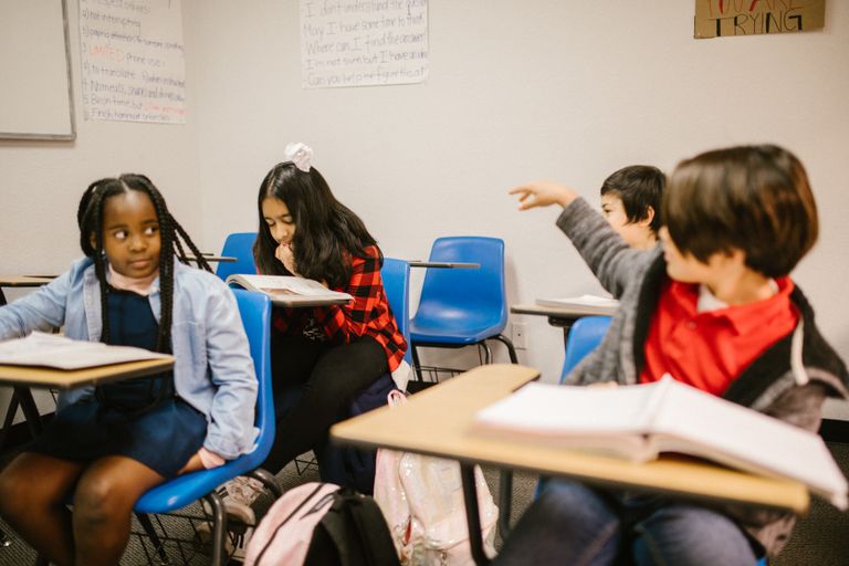 Students in a classroom interacting and engaging with each other.