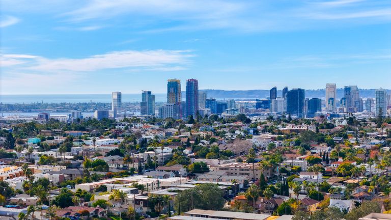 Stunning aerial cityscape of downtown San Diego featuring urban skyline and suburban sprawl.