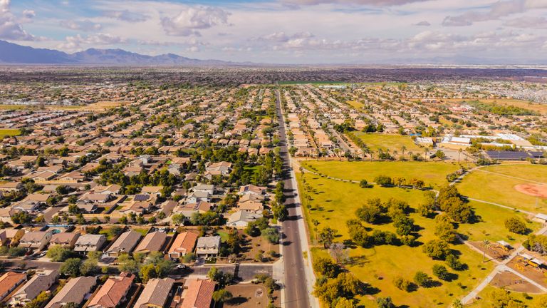 Stunning aerial view of a suburban neighborhood in Arizona with clear skies.