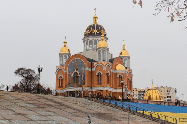 Stunning view of a Ukrainian Orthodox church with golden domes in Kyiv, Ukraine.