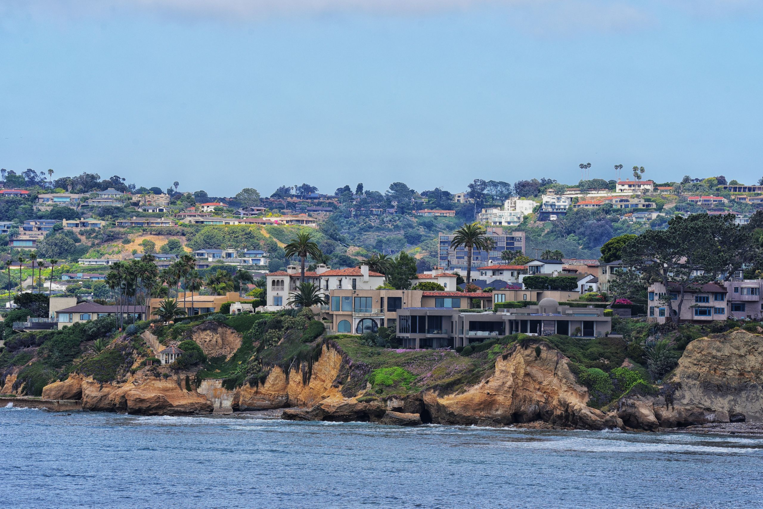 Stunning view of La Jolla cliffs and luxurious homes along the San Diego coastline.