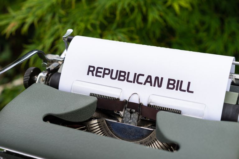 Typewriter displaying 'Republican Bill' in an outdoor setting.