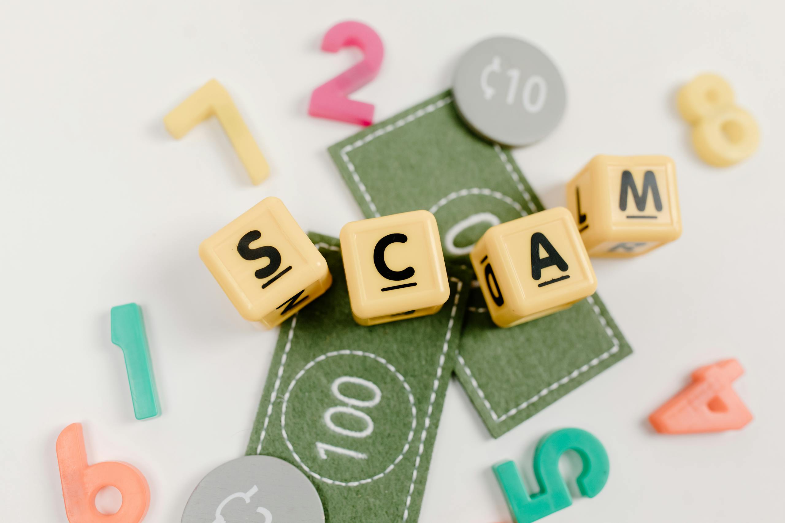 Visual representation of a scam concept using toys, dice, and fake money on a white background.