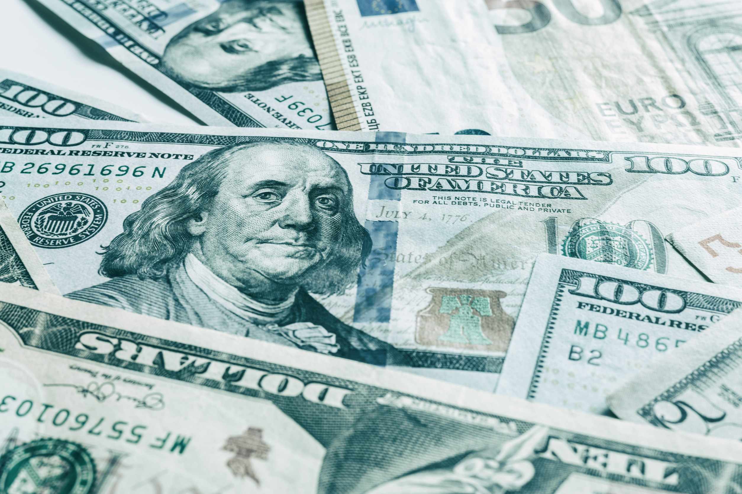 International currencies background. Money from different countries: dollars, euros. euro and dollar banknotes. money background. leading currencies. Selective focus. Close-up.