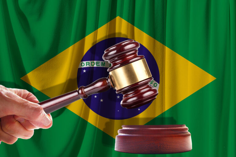 Judge wooden gavel on the background of the flag of Brazil. Oil and gas industry. The concept of oil fields and oil companies.