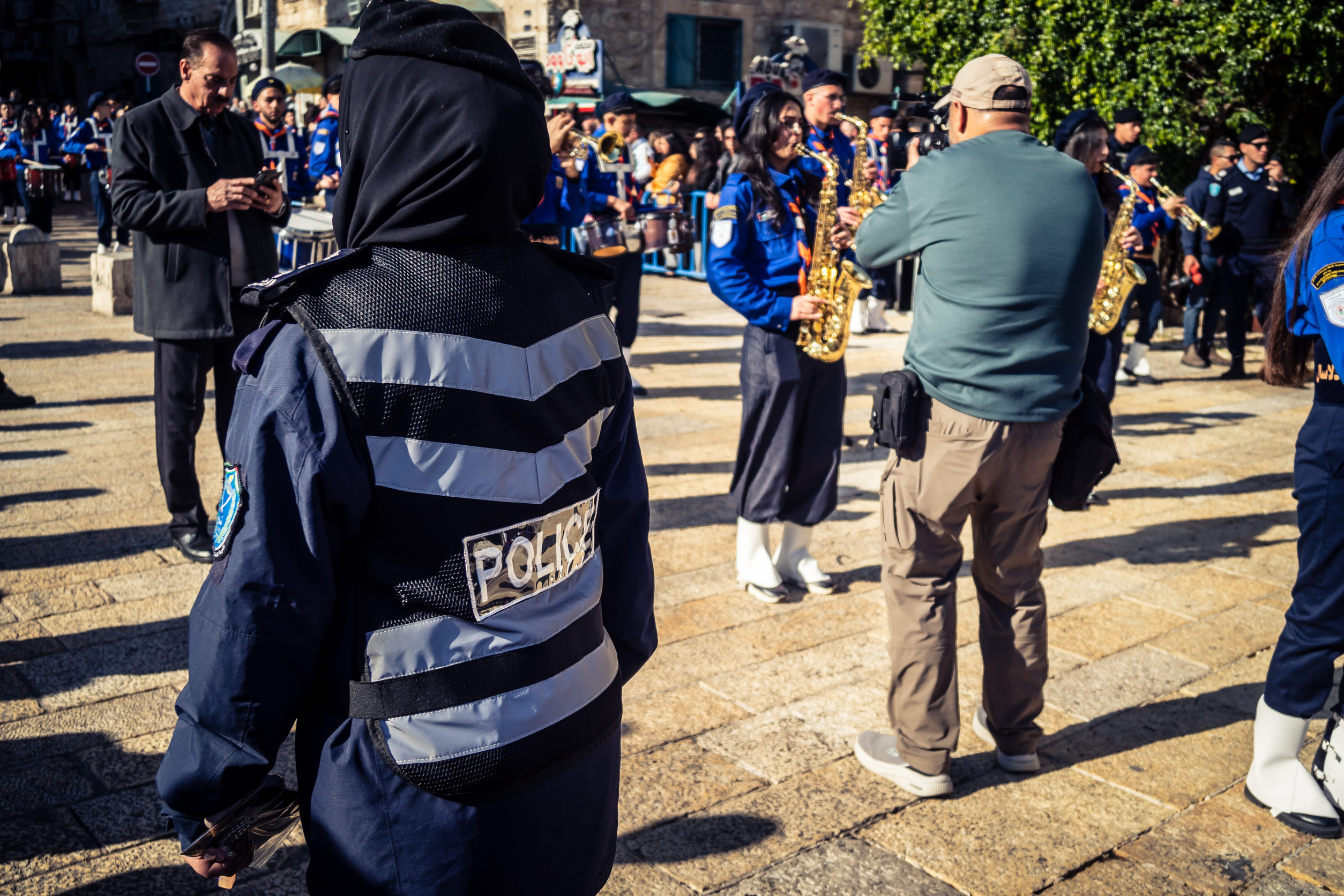 Bethlehem, West Bank, December 24, 2025 Security forces maintain a heavy presence to ensure safety during the annual Christmas parade. Officers are seen monitoring and managing security perimeters.