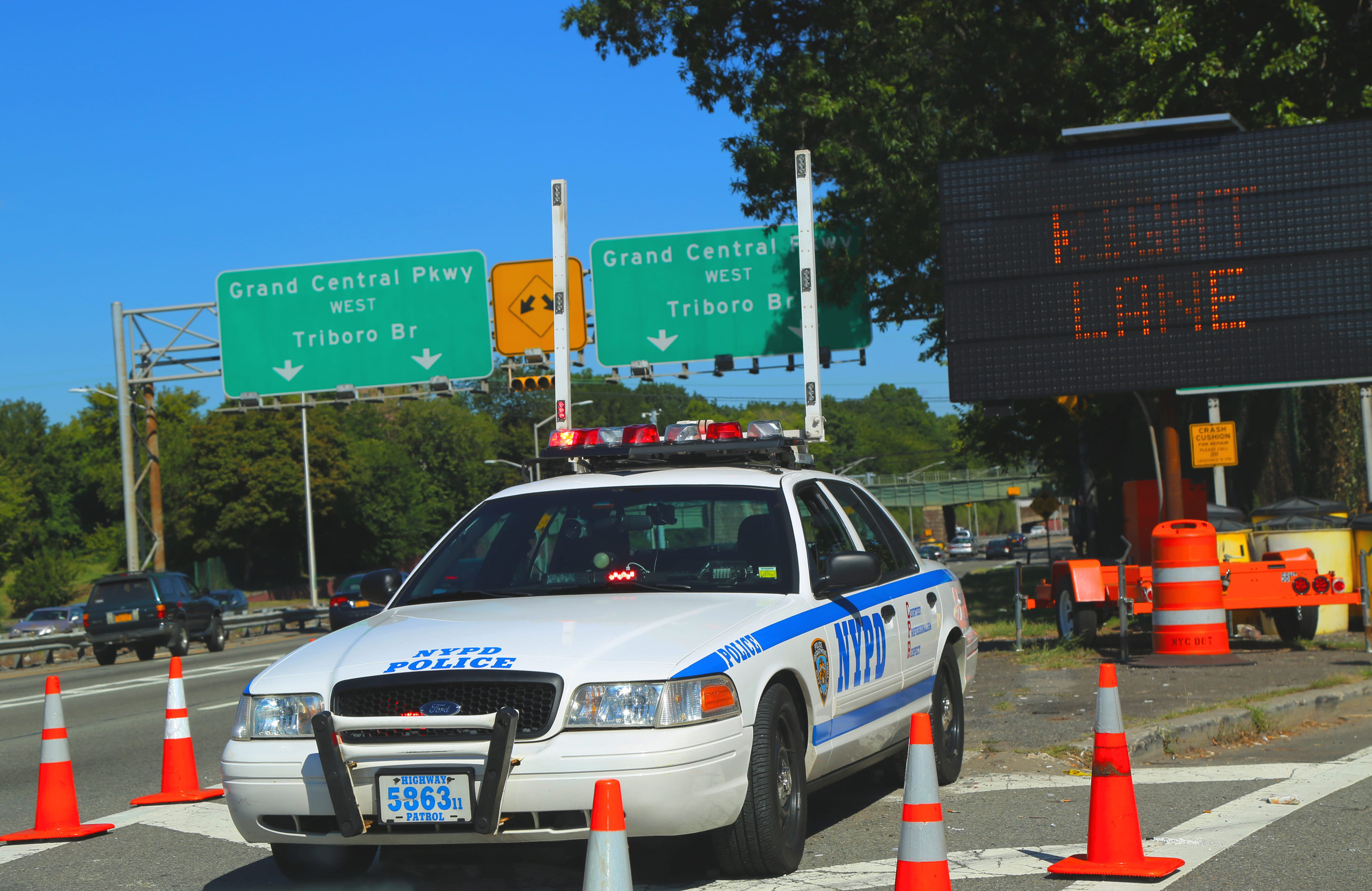 NEW YORK - AUGUST 28: NYPD highway patrol car at Grand Central Parkway in Queens on August 28, 2014. The New York Police Department, established in 1845, is the largest police force in USA