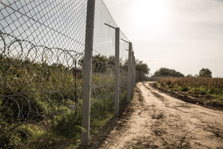 ROESZKE, HUNGARY - SEPTEMBER 15: View on the 175km long fence between Hungary and Serbia installed due to the Refugee crisis on September 15, 2015 in Roeszke, Hungary.