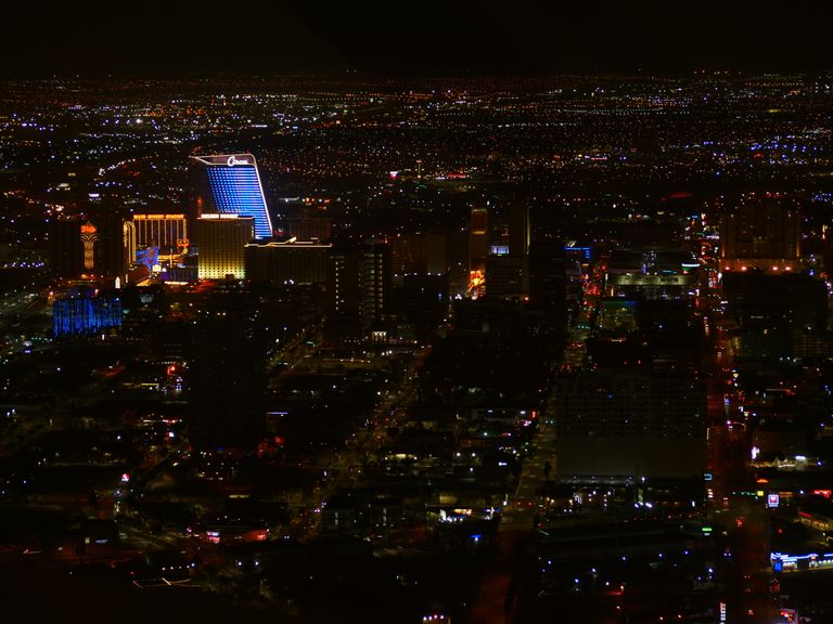 A captivating aerial view of Las Vegas' illuminated skyline at night, capturing its vibrant urban energy.