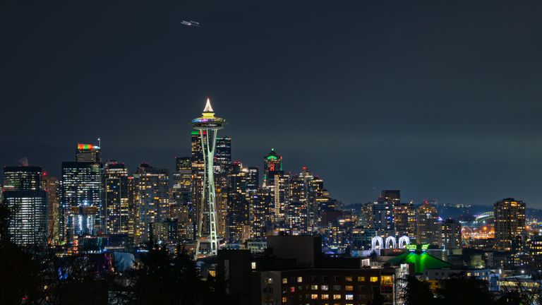 Stunning Seattle skyline at night with iconic Space Needle illuminated against city lights.